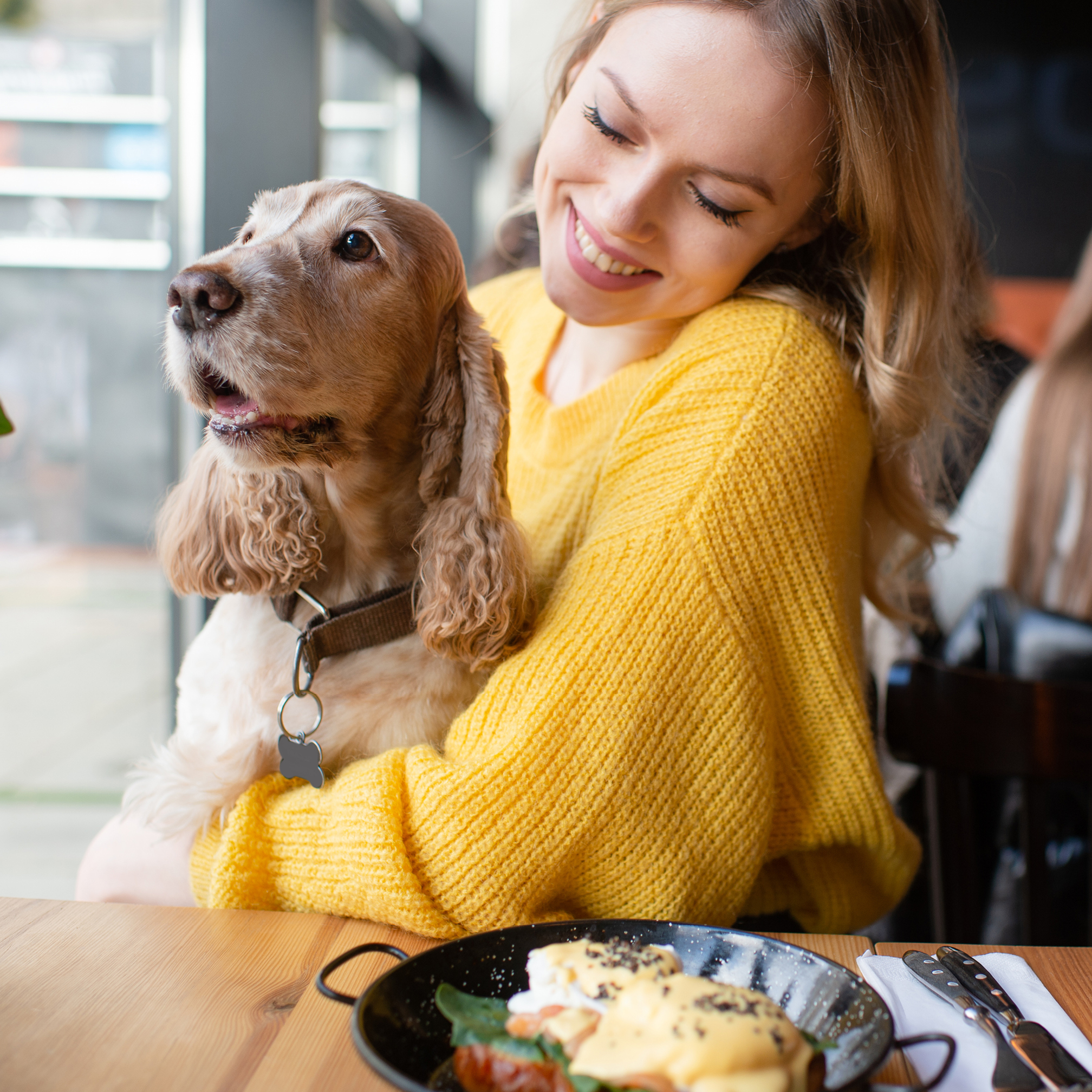 Young woman with golden retriever